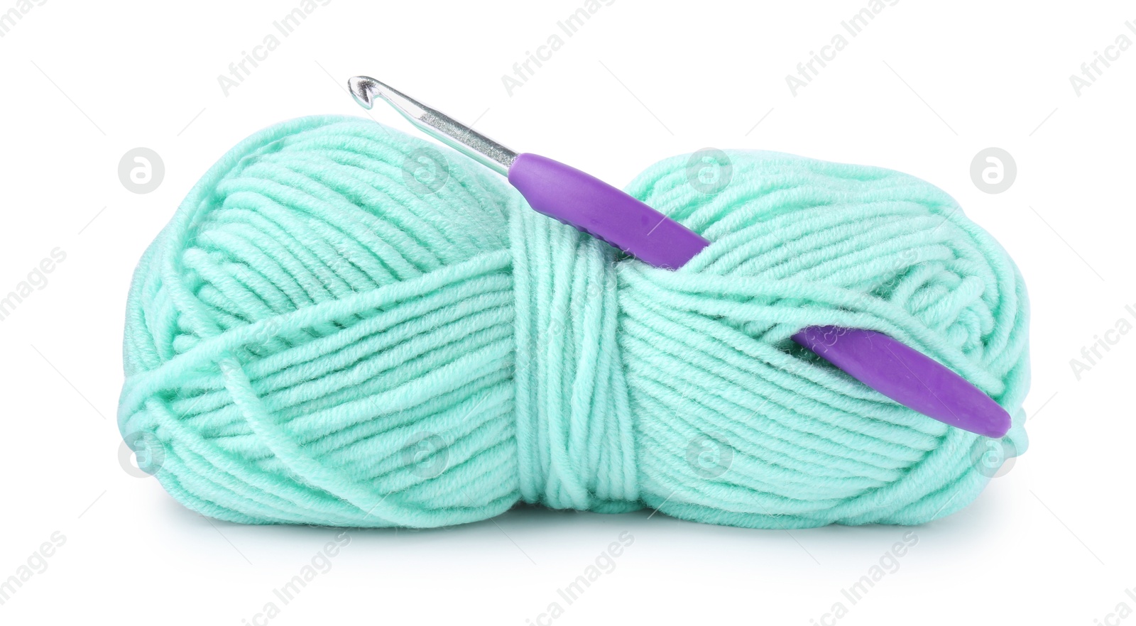 Photo of Skein of yarn and crochet hook isolated on white