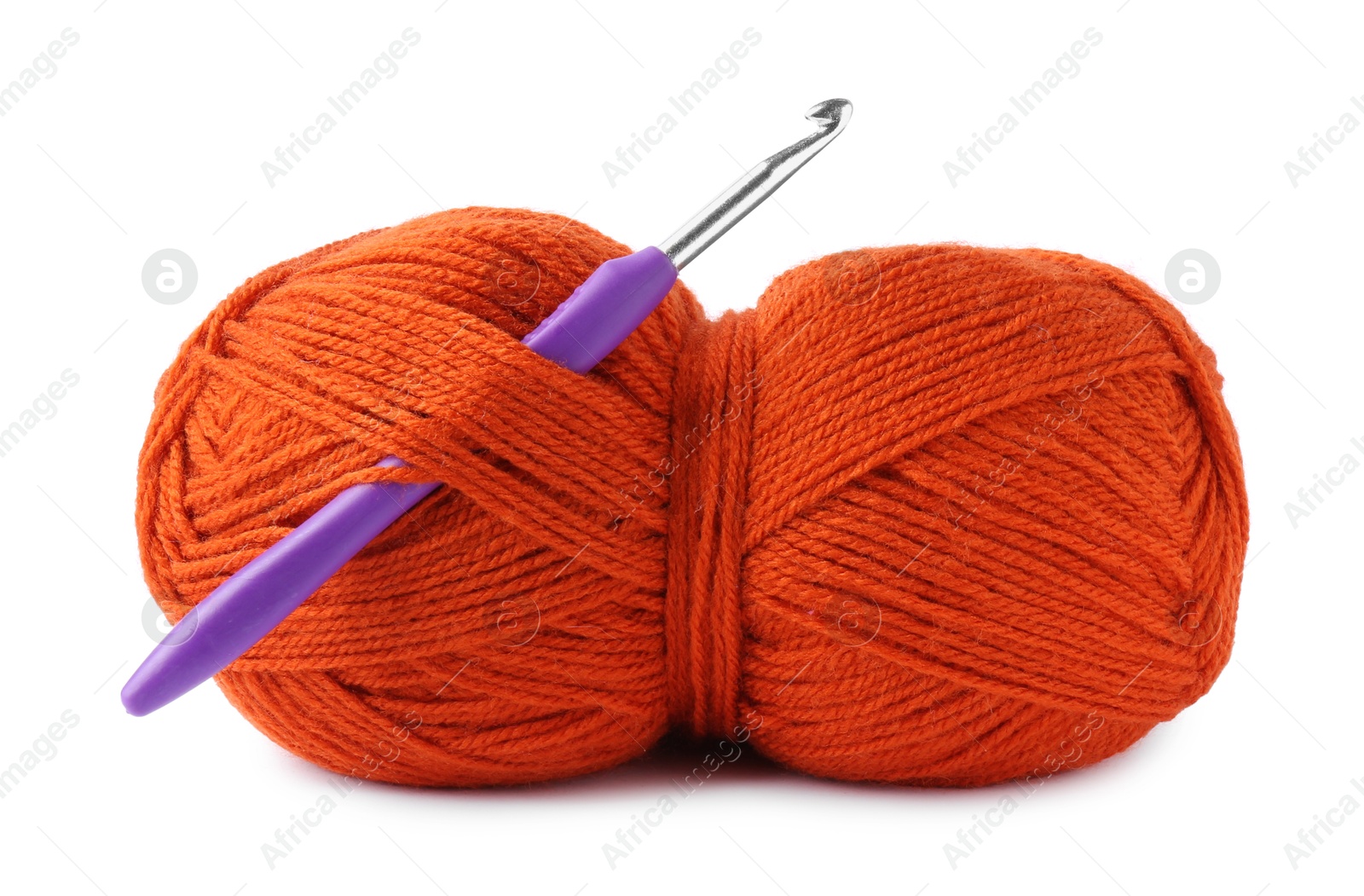 Photo of Orange skein of yarn and crochet hook isolated on white