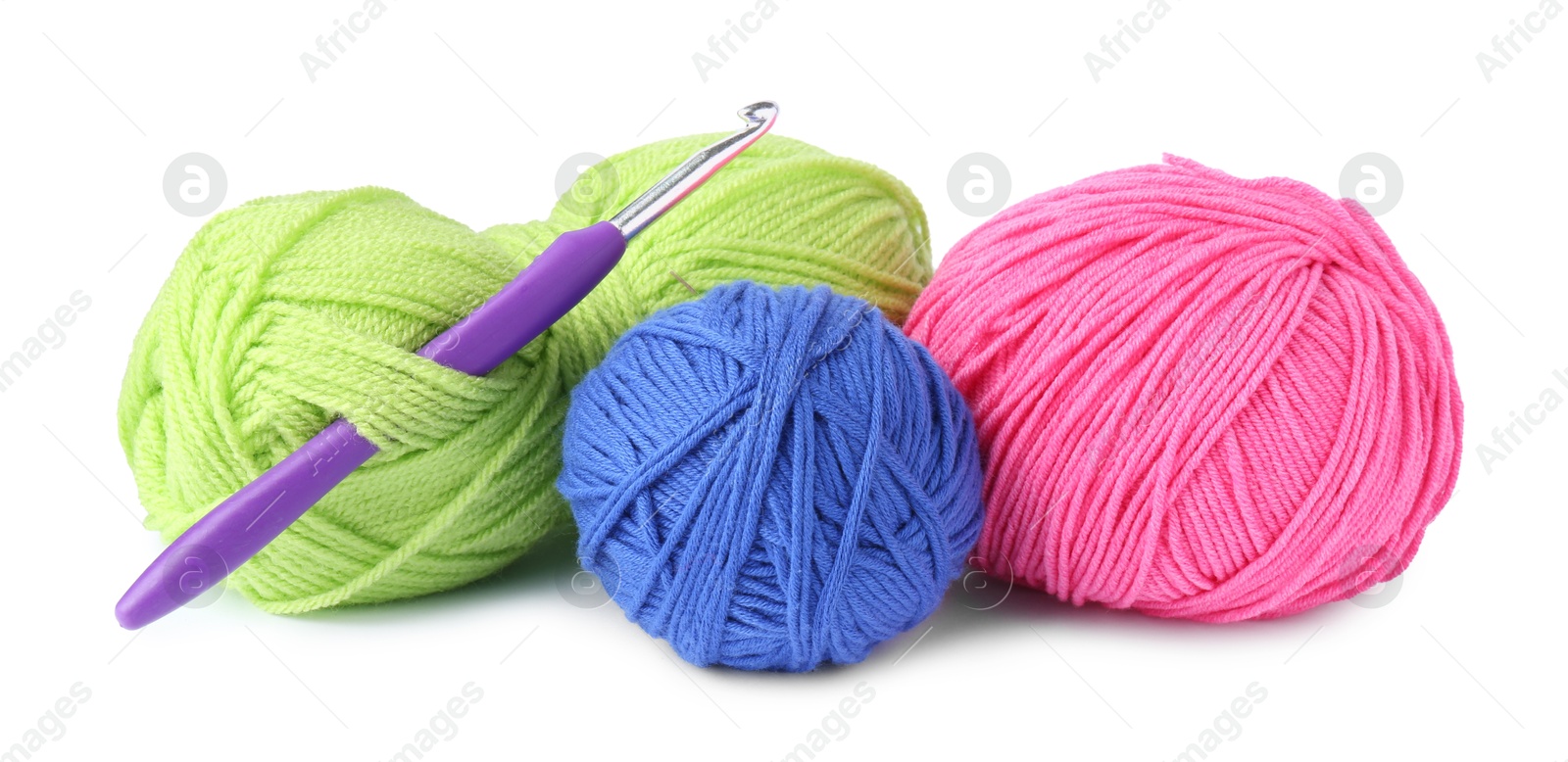 Photo of Different yarns and crochet hook isolated on white