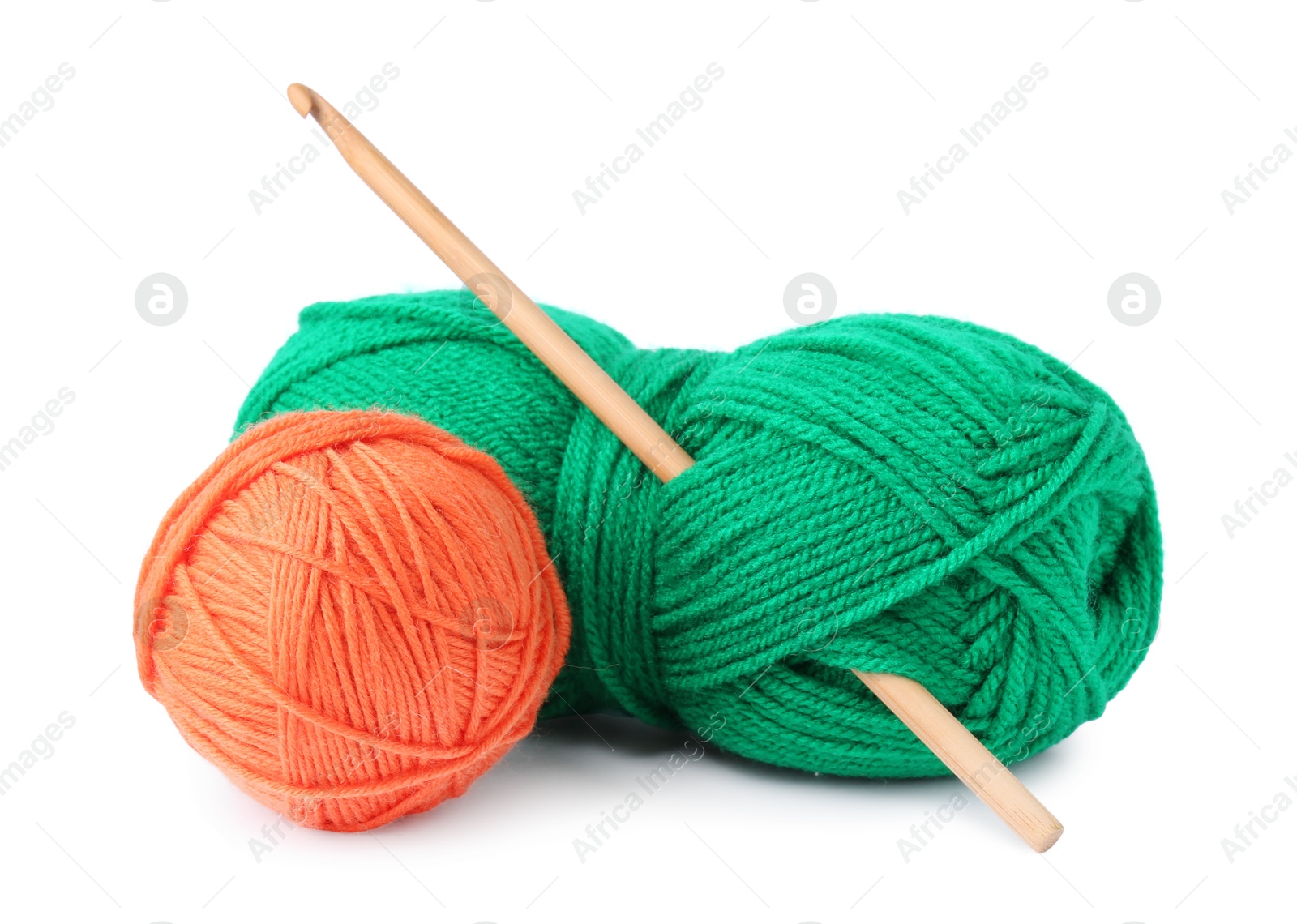 Photo of Colorful yarns and crochet hook isolated on white