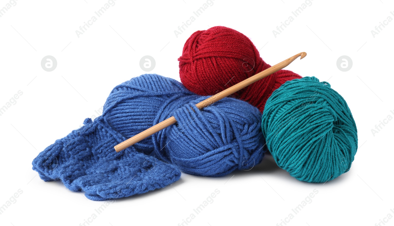 Photo of Different yarns, pattern sample and crochet hook isolated on white