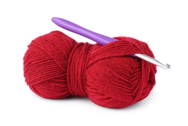 Photo of Red skein of yarn and crochet hook isolated on white