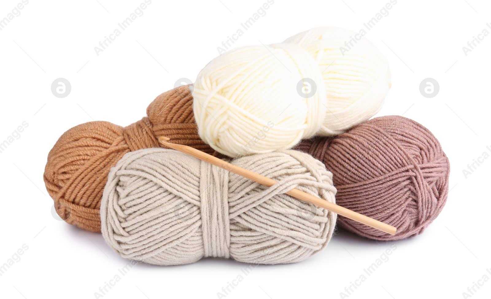 Photo of Different yarns and crochet hook isolated on white