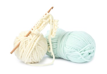 Photo of Colorful yarns and crochet hook isolated on white