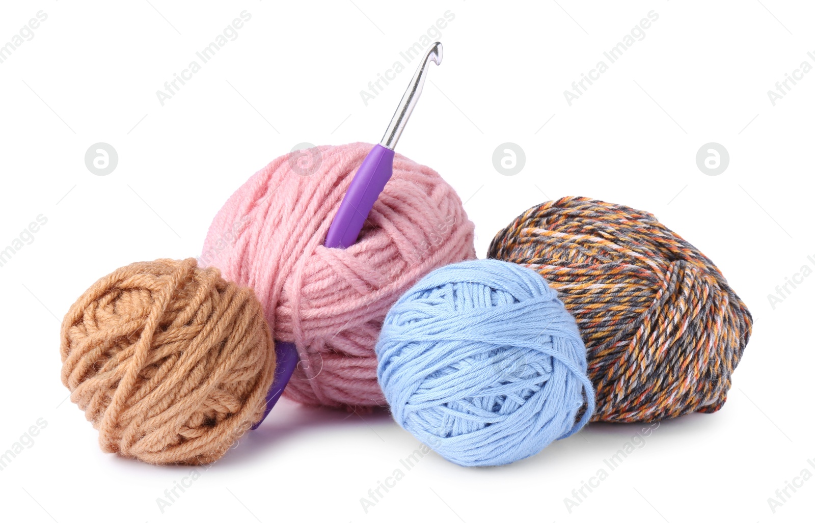 Photo of Colorful balls of yarn and crochet hook isolated on white