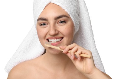 Beautiful woman brushing her teeth on white background