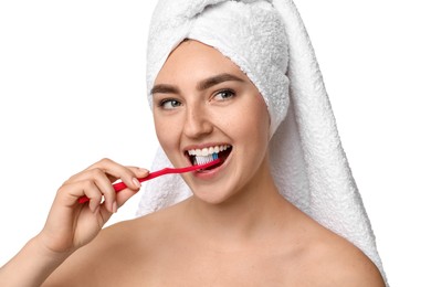 Beautiful woman brushing her teeth on white background