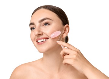 Photo of Beautiful young woman doing facial massage with roller on white background