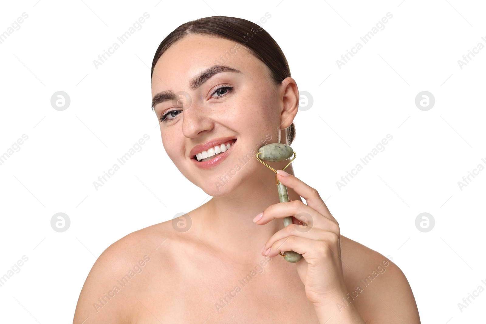 Photo of Beautiful young woman doing facial massage with roller on white background