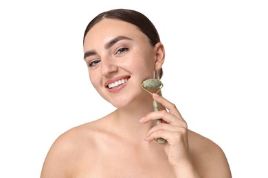 Photo of Beautiful young woman doing facial massage with roller on white background