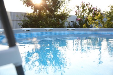 Photo of Above ground swimming pool outdoors on sunny day, closeup