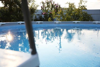 Photo of Above ground swimming pool outdoors on sunny day, closeup