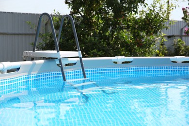 Above ground swimming pool outdoors on sunny day, closeup