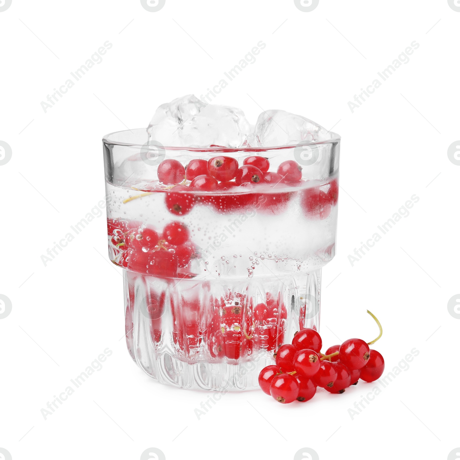 Photo of Refreshing water with red currants in glass isolated on white