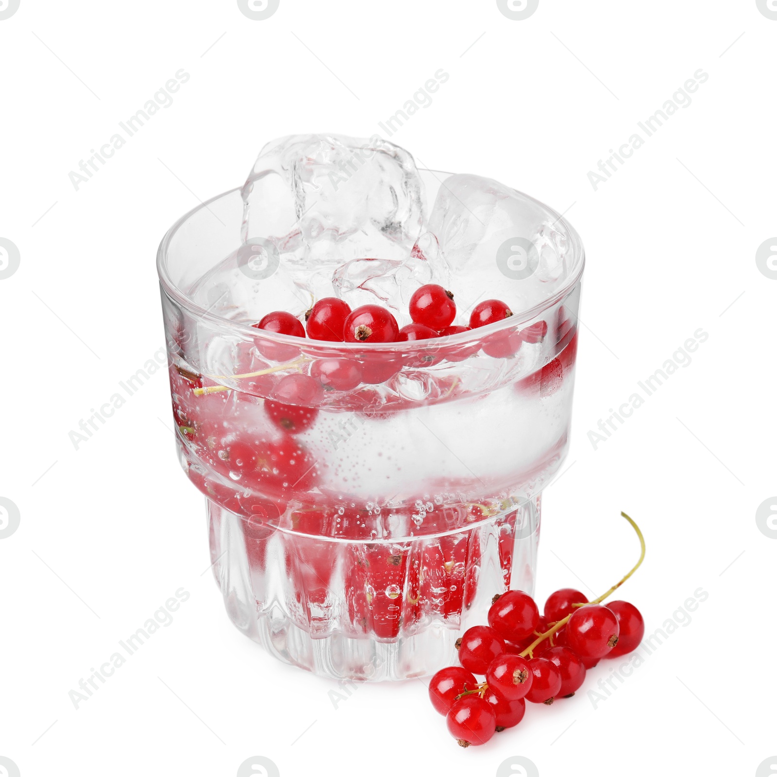 Photo of Refreshing water with red currants in glass isolated on white