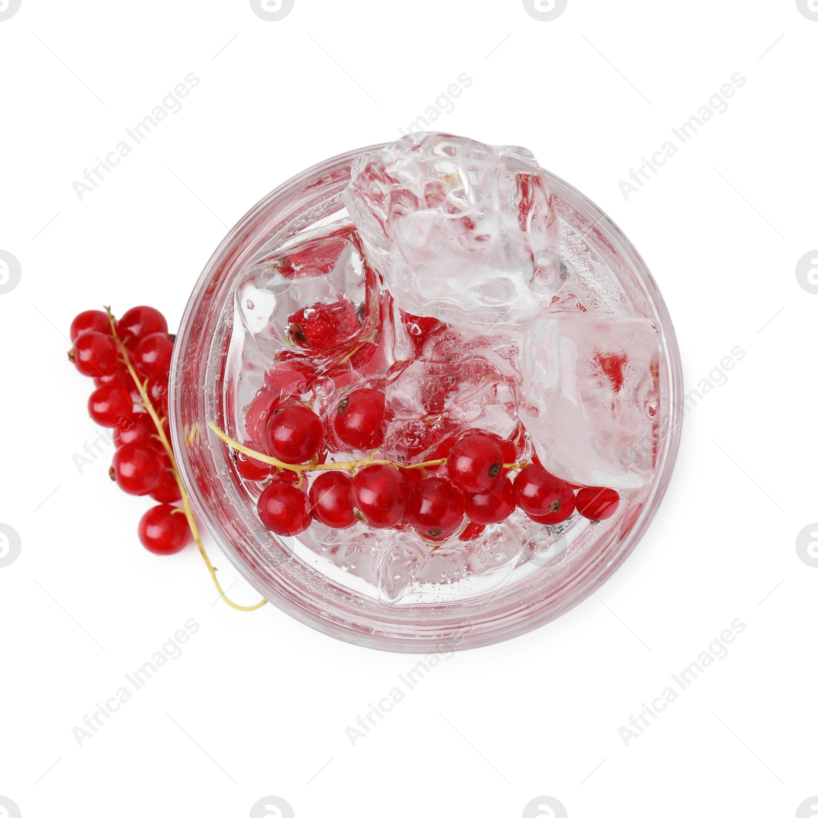 Photo of Refreshing water with red currants in glass isolated on white