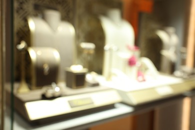 Photo of Blurred view of store display with different jewelry in shopping mall