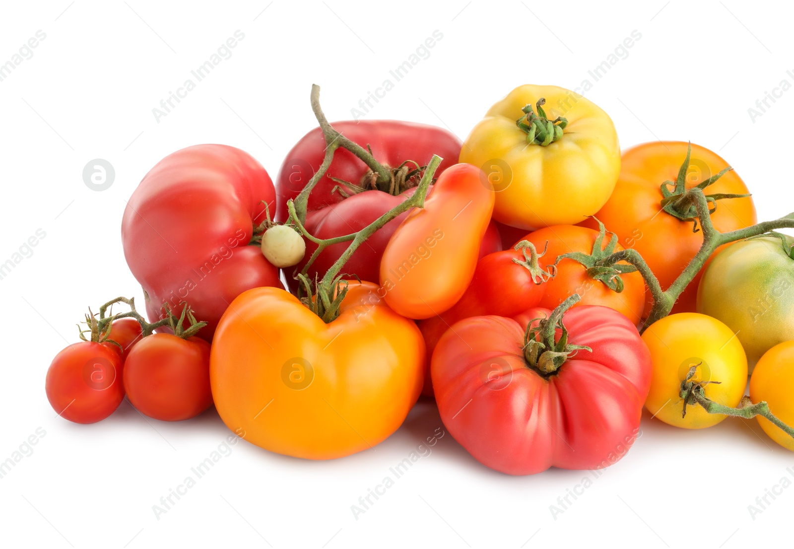 Photo of Different sorts of fresh ripe tomatoes isolated on white