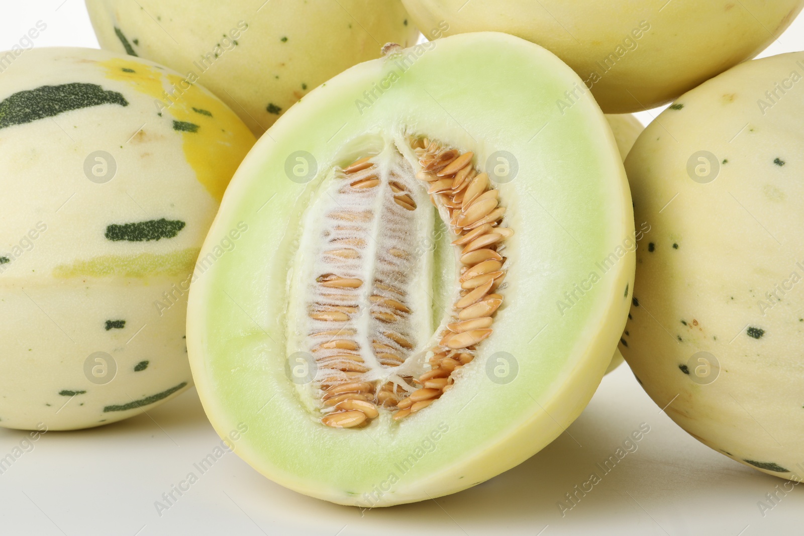 Photo of Fresh ripe honeydew melons on white background, closeup