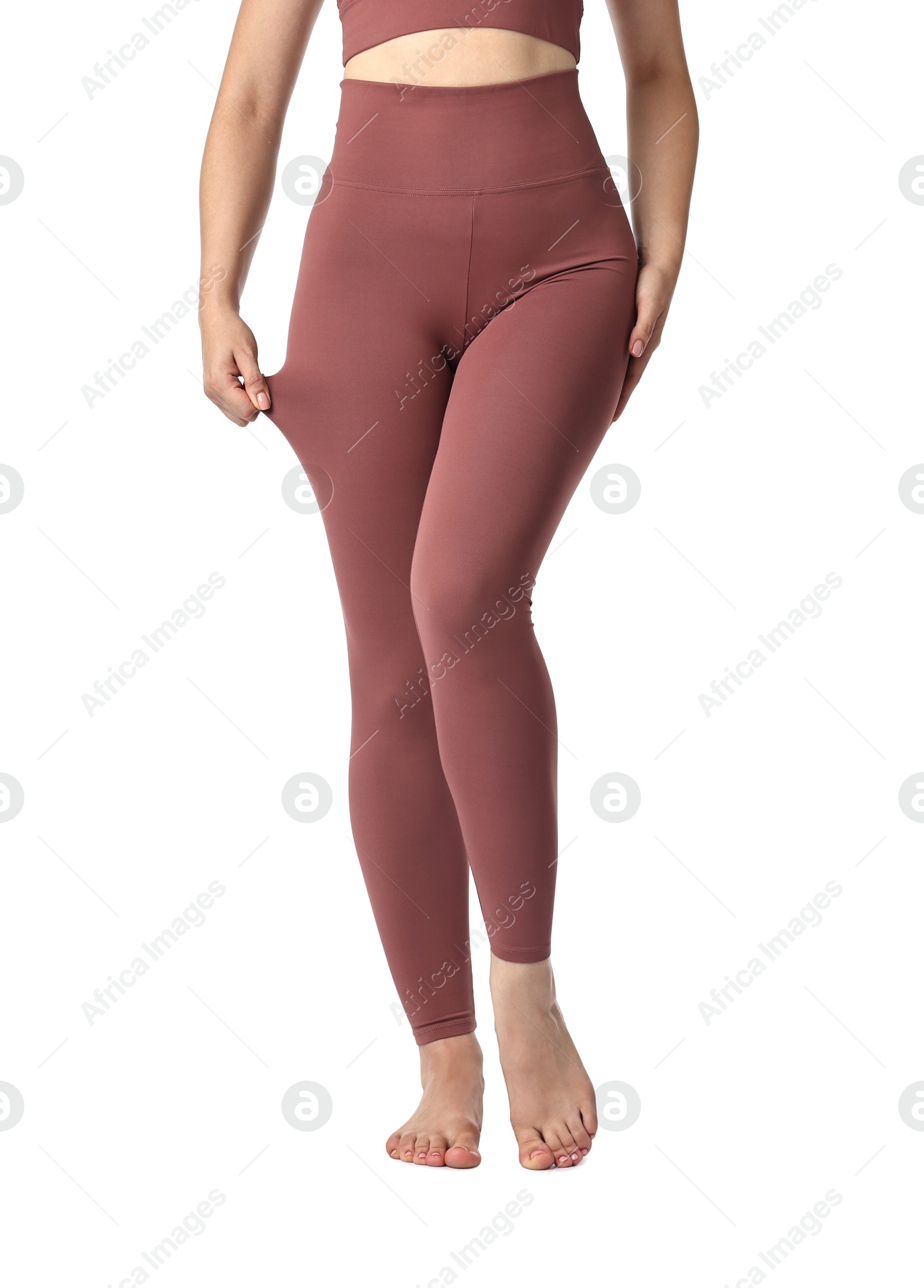 Photo of Woman wearing sports leggings on white background, closeup