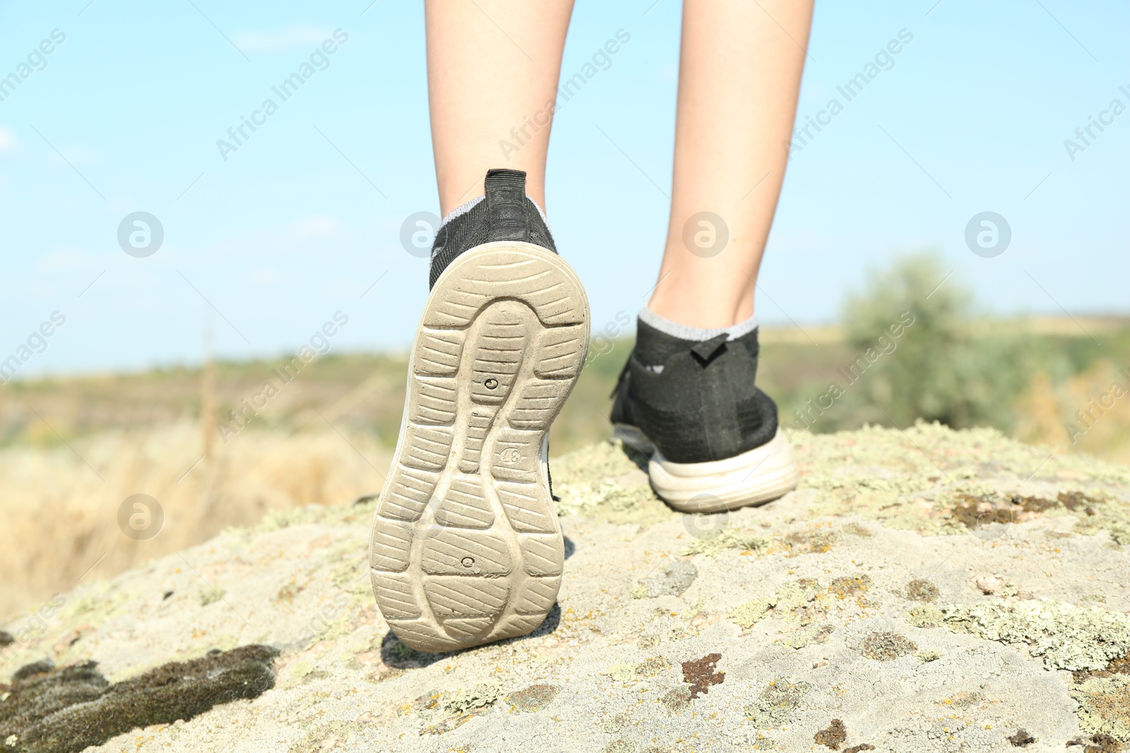 Photo of Little boy travelling outdoors on sunny day, closeup