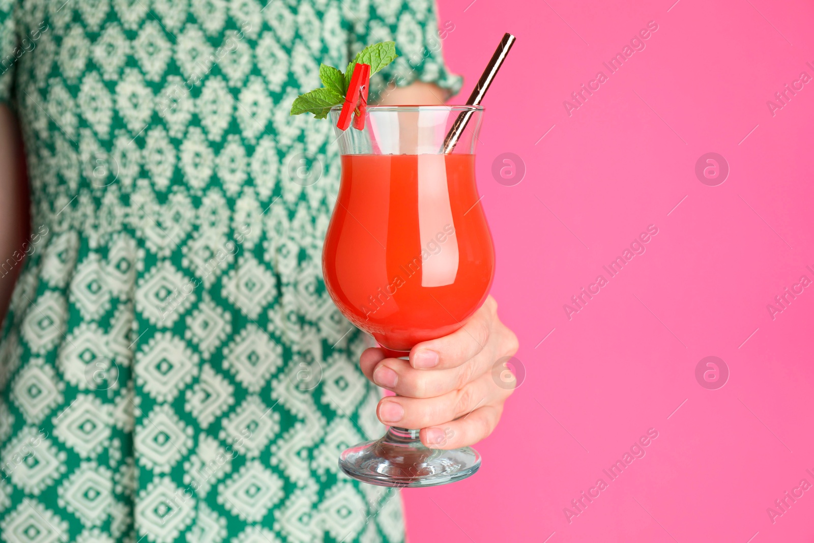 Photo of Woman with glass of refreshing cocktail on pink background, closeup. Space for text