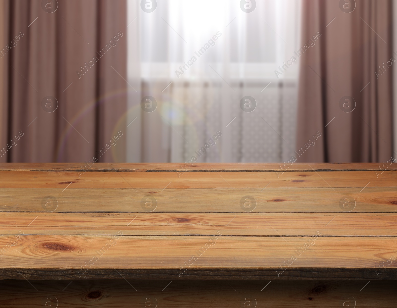 Image of Empty wooden table near window with curtains. Space for design