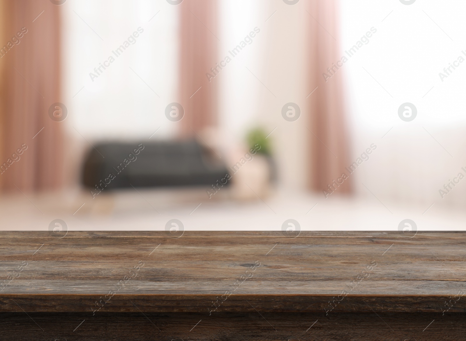 Image of Empty wooden table near window with curtains. Space for design