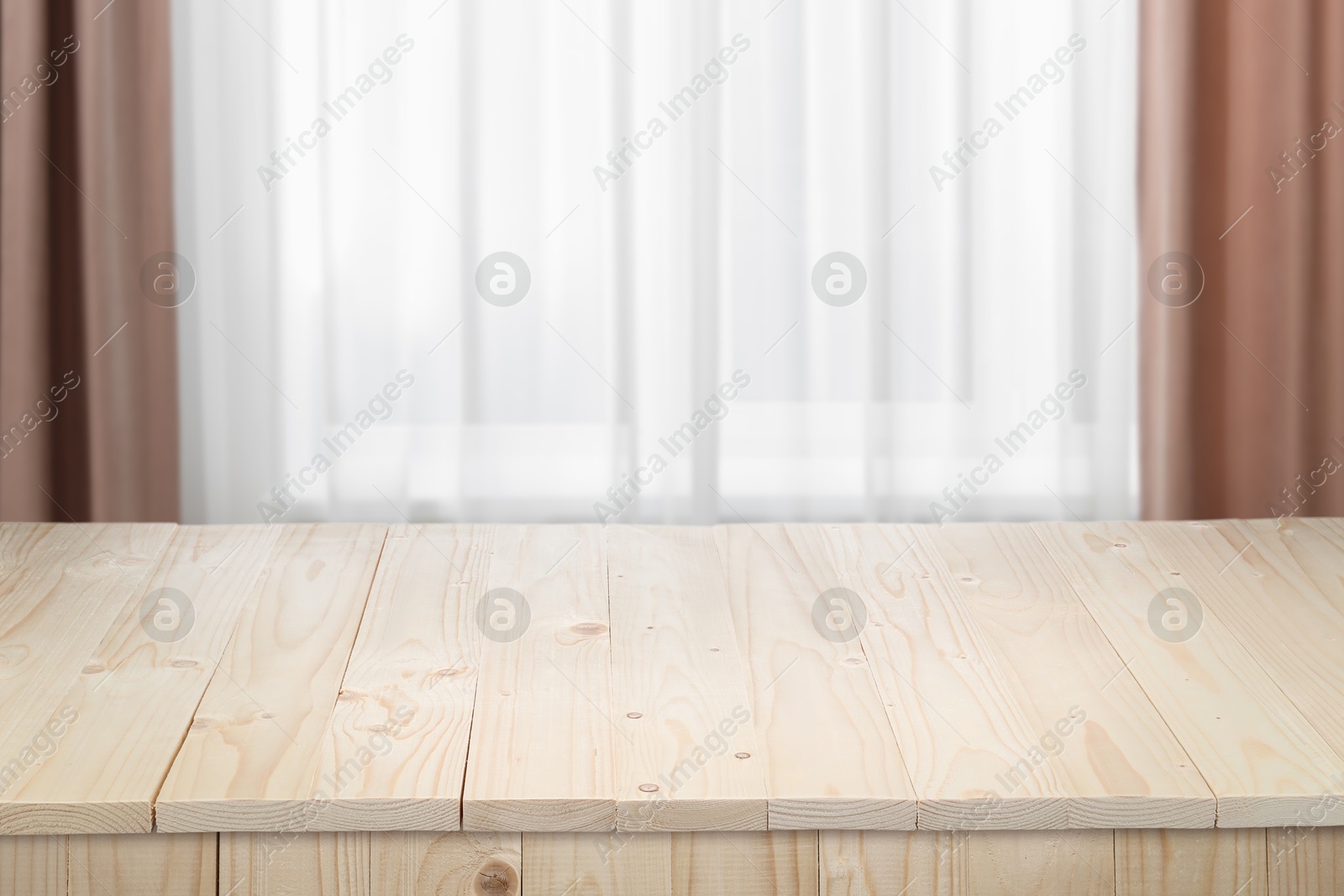 Image of Empty white wooden table near window with curtains. Space for design