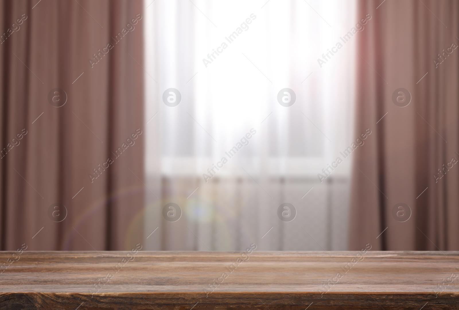 Image of Empty wooden table near window with curtains. Space for design