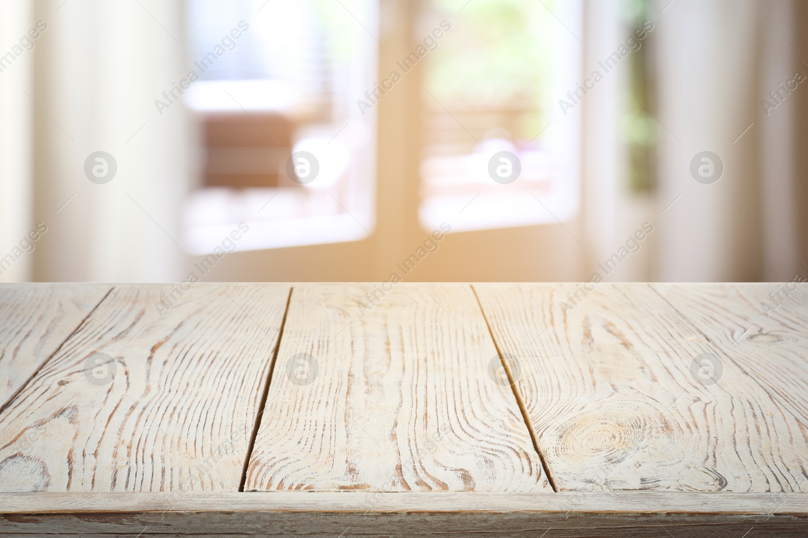 Image of Empty white wooden table near window with curtains. Space for design