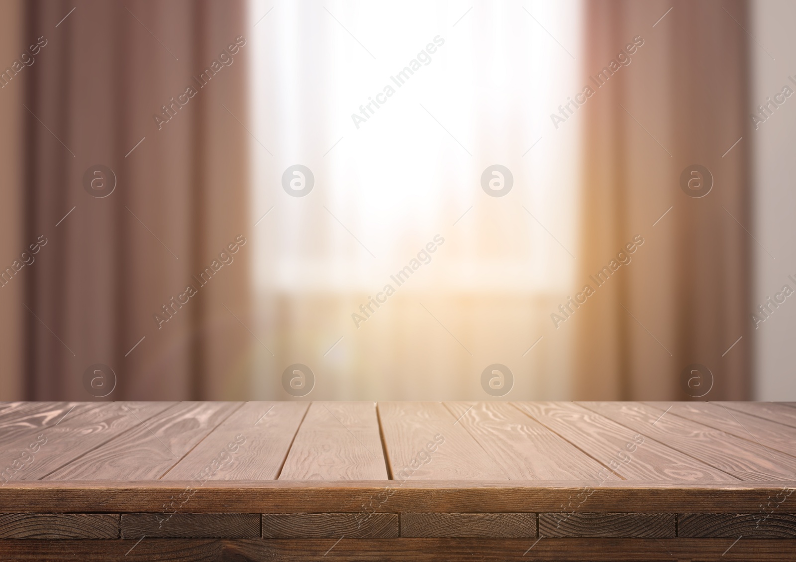 Image of Empty wooden table near window with curtains. Space for design