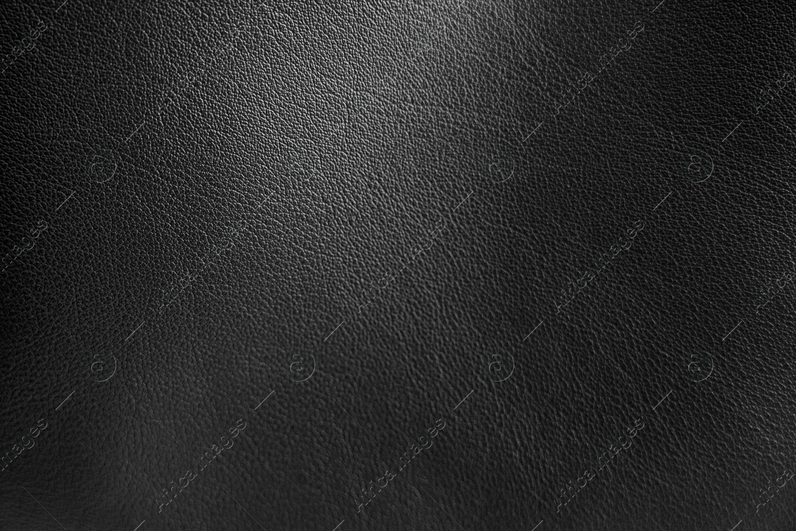 Image of Black leather, closeup view of material texture