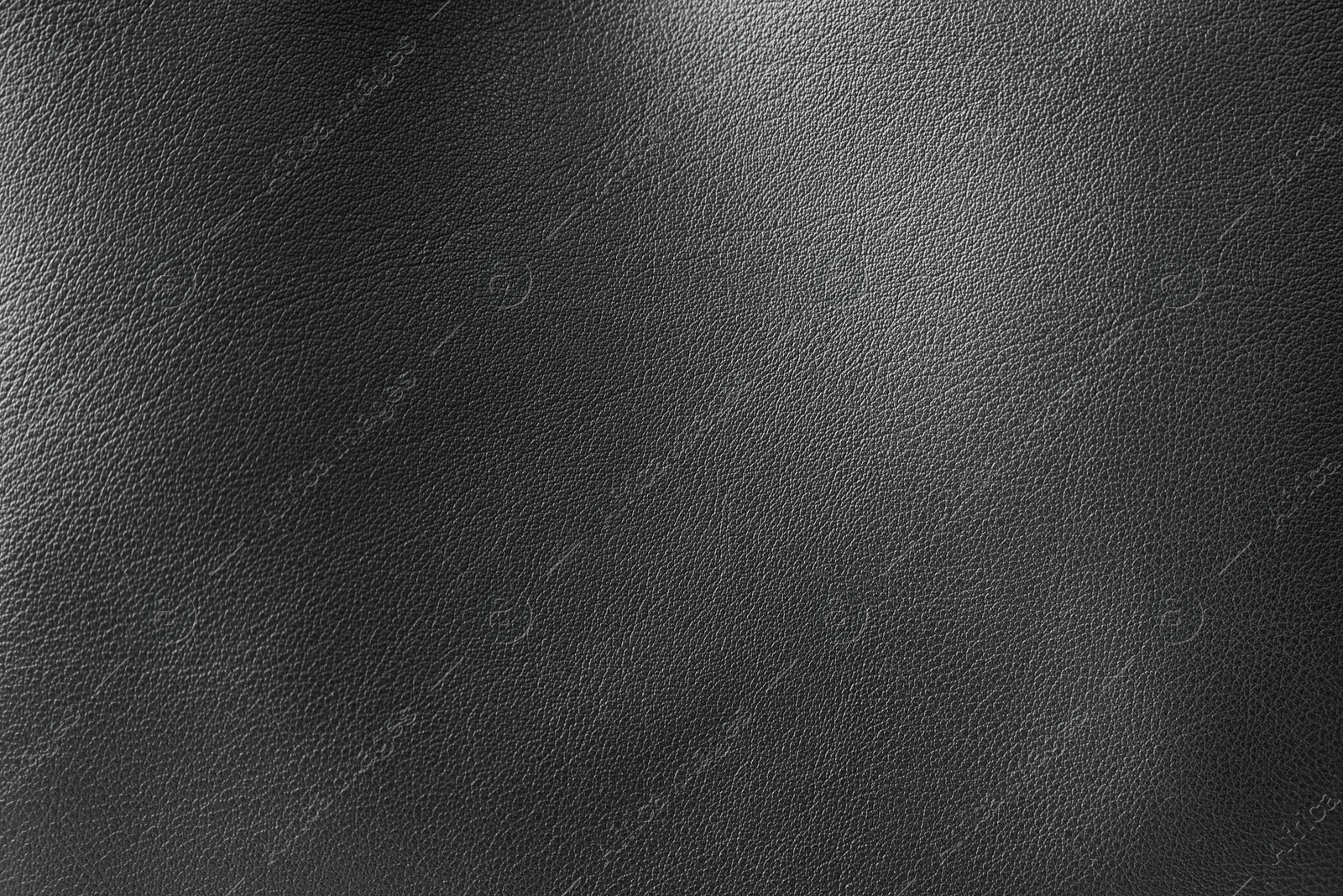 Image of Black leather, closeup view of material texture