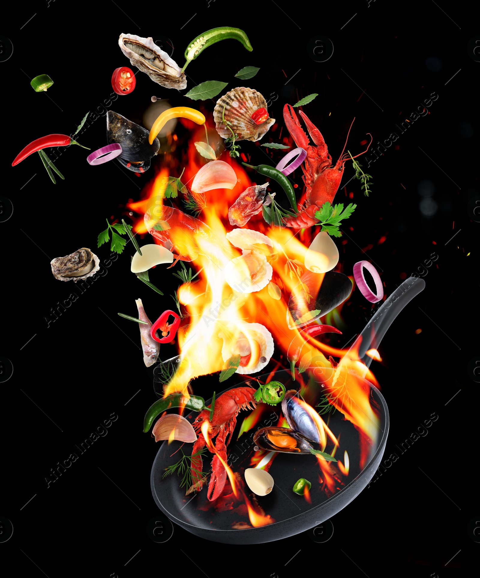 Image of Sea food, vegetables, herbs, spices and frying pan in air on black background. Cooking meal