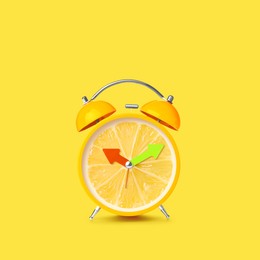 Image of Juicy lemon on alarm clock dial against yellow background. Creative poster