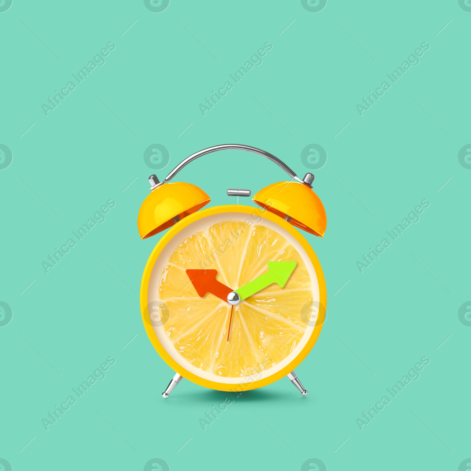 Image of Juicy lemon on alarm clock dial against turquoise background. Creative poster