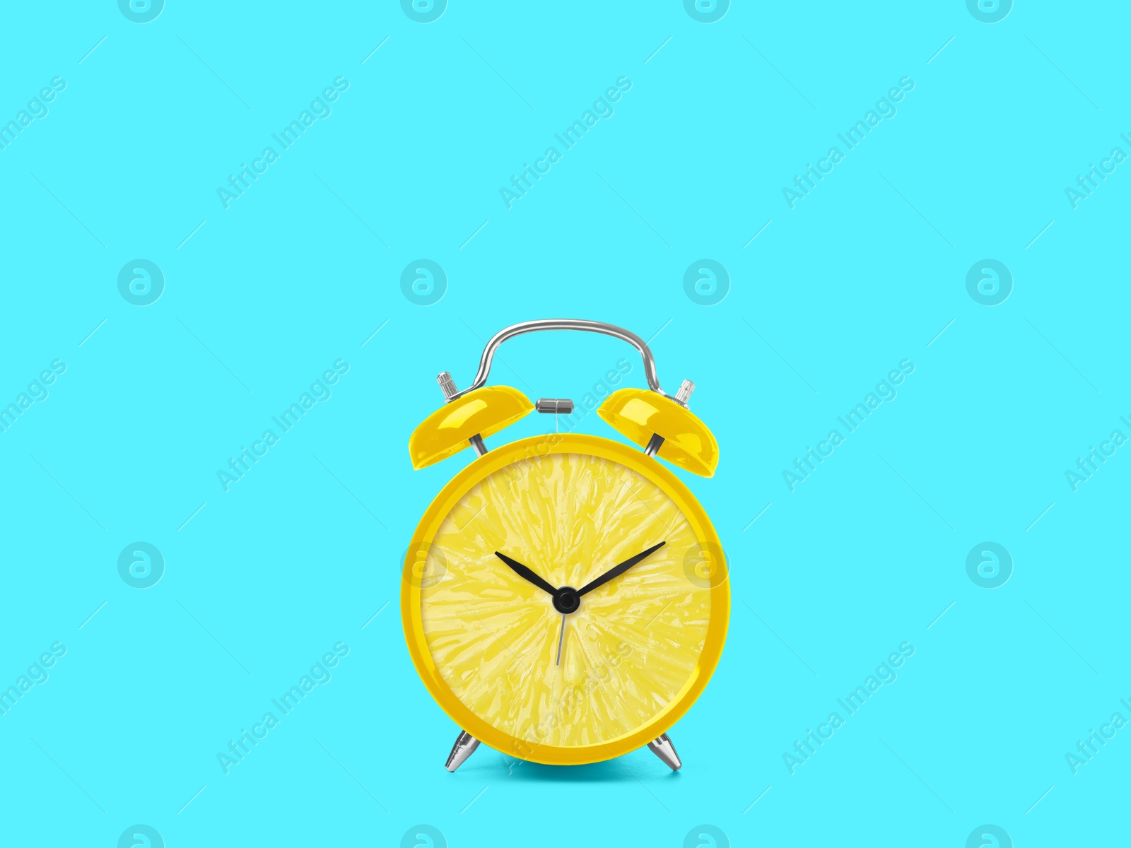 Image of Juicy lemon on alarm clock dial against light blue background. Creative poster