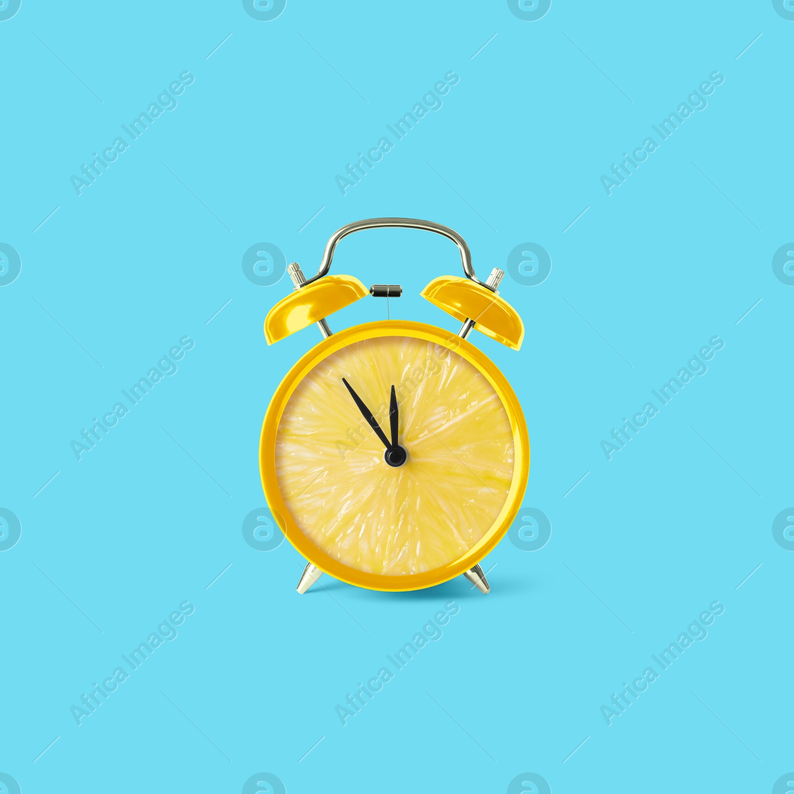 Image of Juicy lemon on alarm clock dial against light blue background. Creative poster