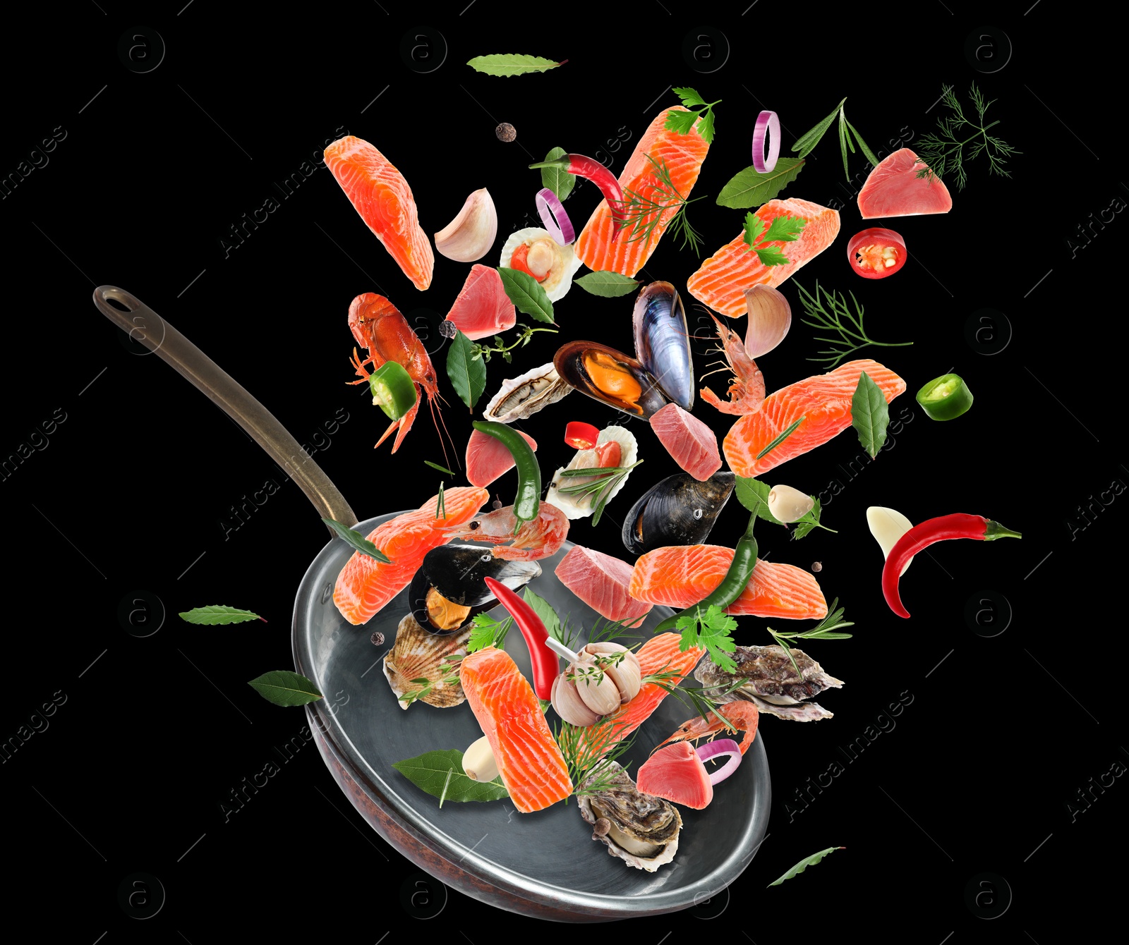 Image of Sea food, vegetables, herbs, spices and frying pan in air on black background. Cooking meal