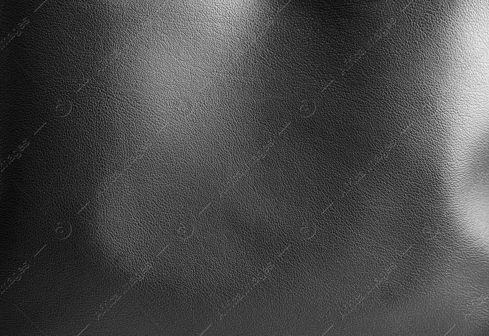 Image of Black leather, closeup view of material texture