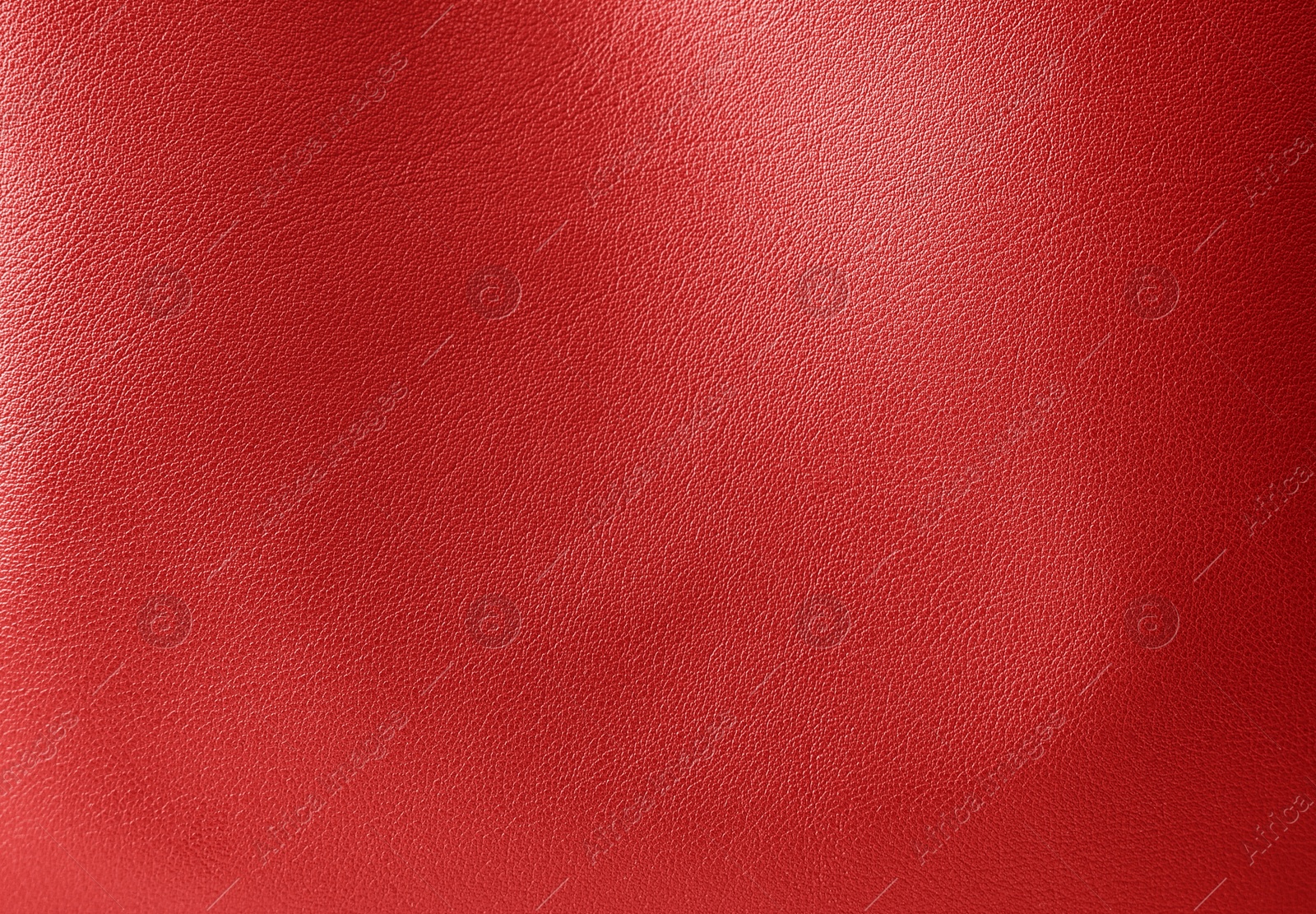 Image of Red leather, closeup view of material texture