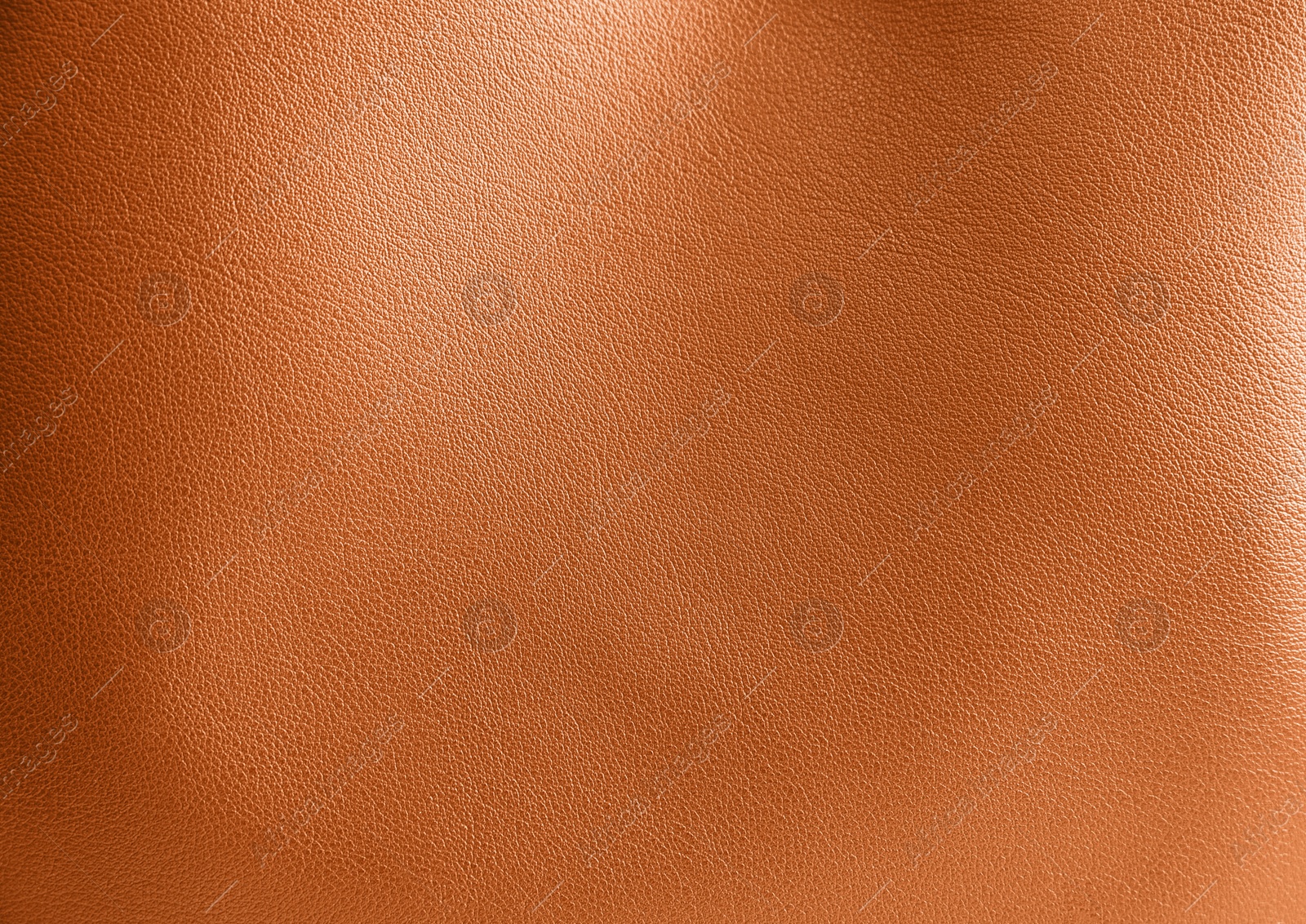 Image of Orange leather, closeup view of material texture