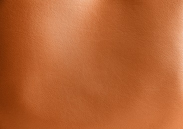 Image of Orange leather, closeup view of material texture