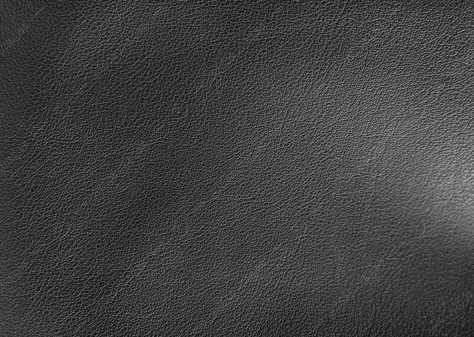 Image of Black leather, closeup view of material texture