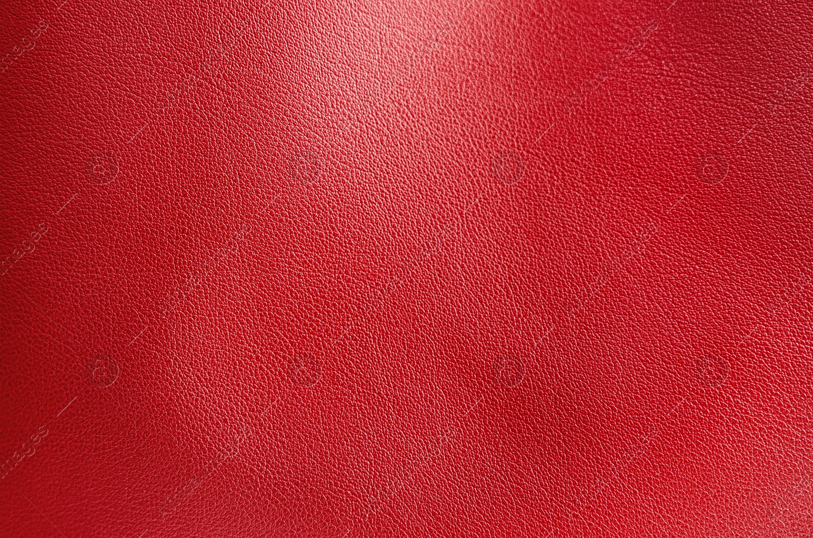 Image of Red leather, closeup view of material texture