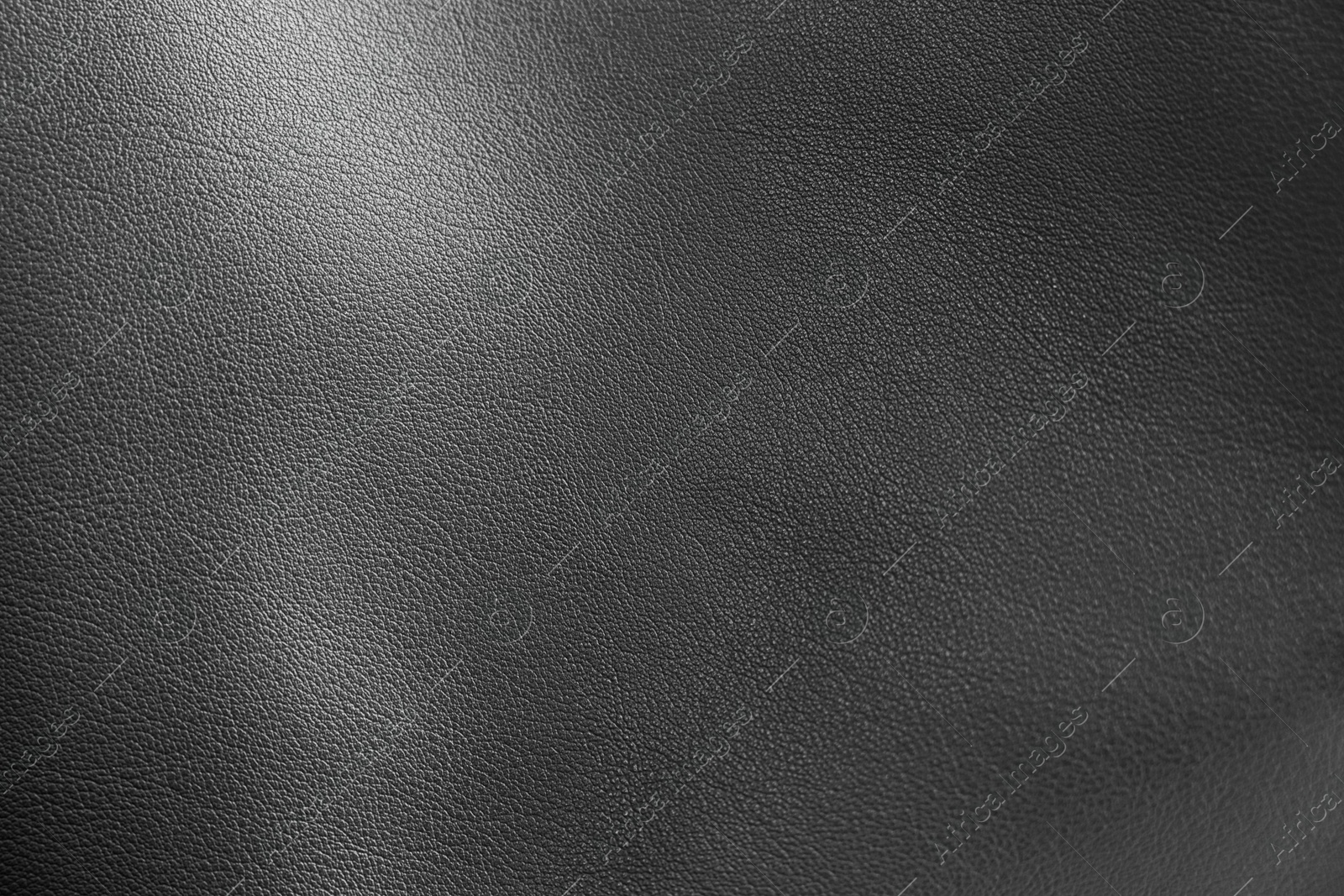 Image of Black leather, closeup view of material texture