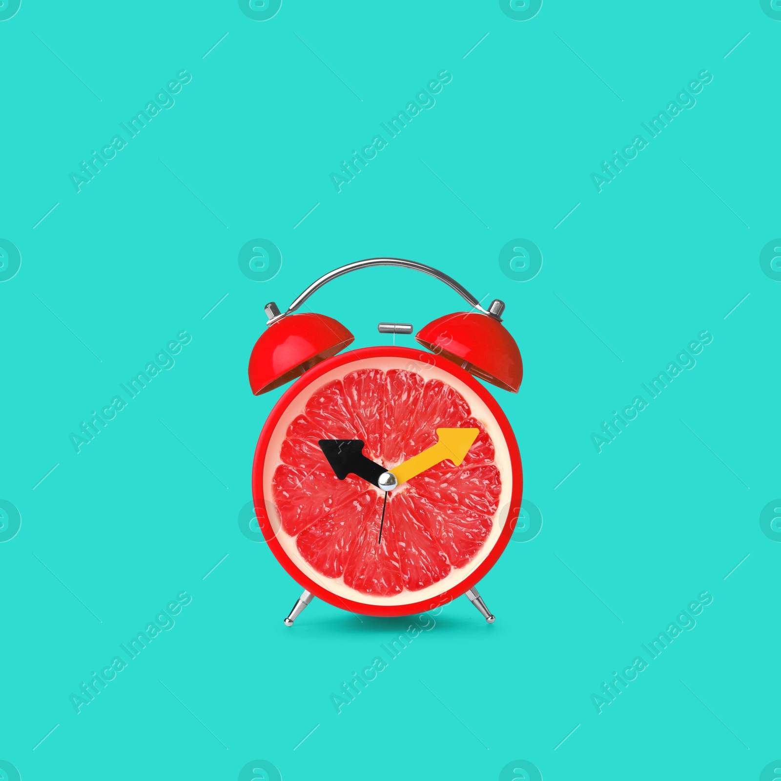 Image of Juicy grapefruit on alarm clock dial against turquoise background. Creative poster