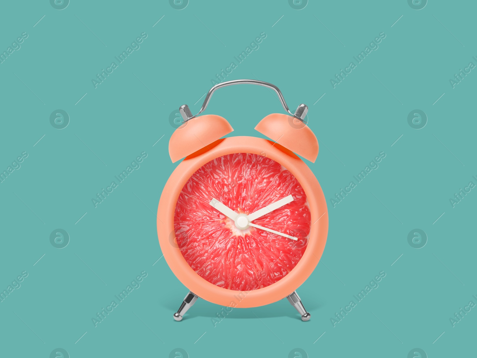 Image of Juicy grapefruit on alarm clock dial against dark turquoise background. Creative poster