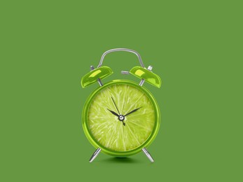 Juicy lime on alarm clock dial against green background. Creative poster